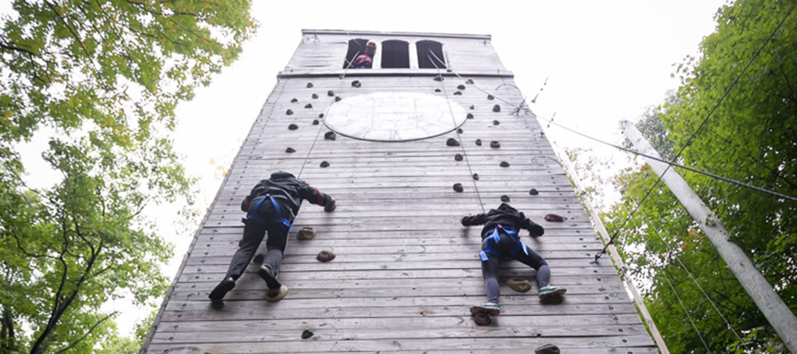 Climbers on a high element of the challenge course